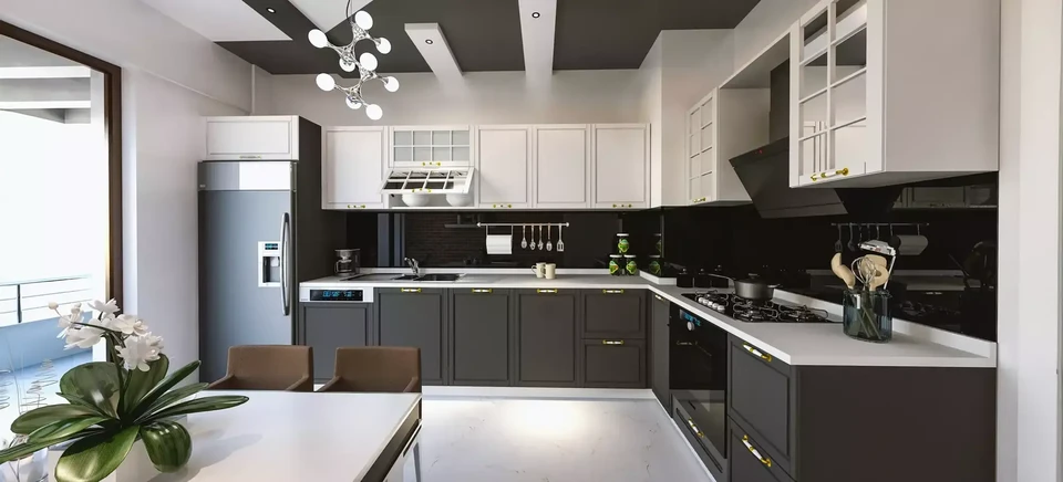 Cuisine en cours avec armoires blanches, comptoirs nus, outils dispersés montre les travaux de rénovation en cours